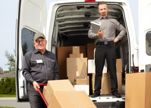 Furniture removals team handling a move in Waterloo near busy local streets