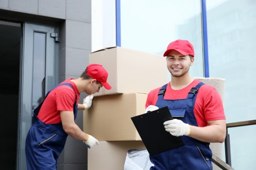Moving boxes and household items being carried through a shared apartment building in Waterloo