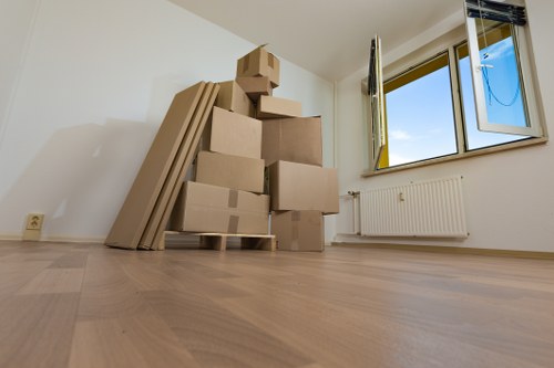 Furniture and boxes being carried through a Waterloo home